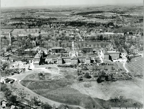 A black-and-white aerial photo of the Phillips Academy campus from the west, circa 1929. Samuel Phillips Hall and its adjacent buildings are centered.