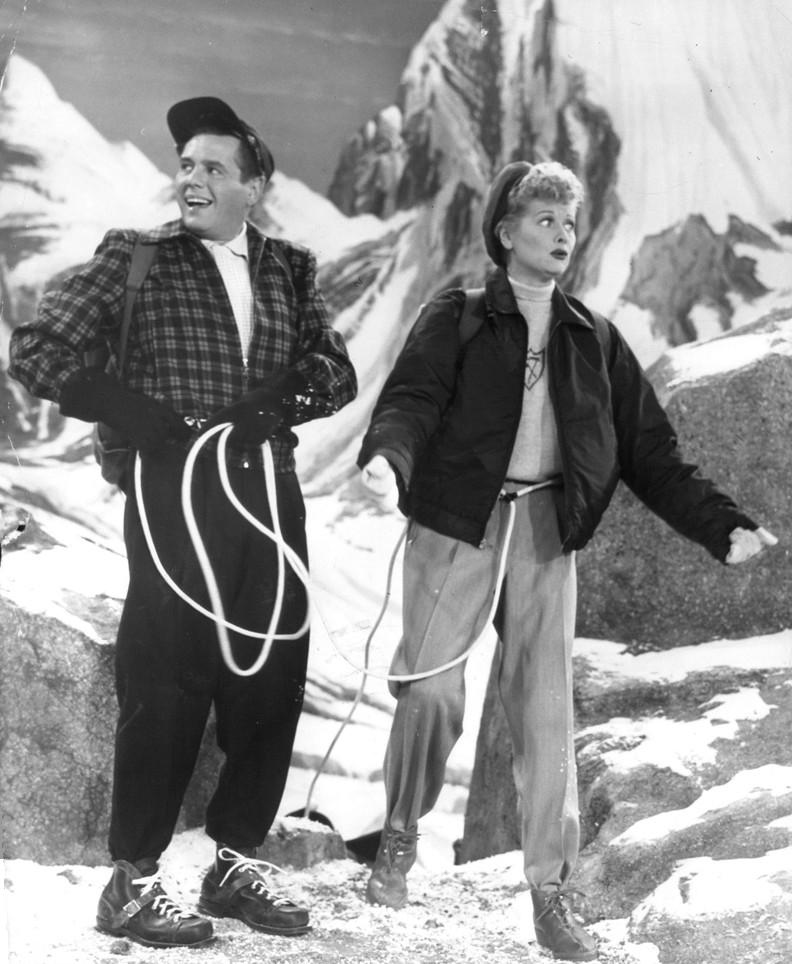 A black-and-white still from the show I Love Lucy, featuring Rick and Lucy in climbing gear standing on a mountain.
